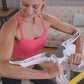 Arm strength training device on forearms with yellow resistance band during home exercise