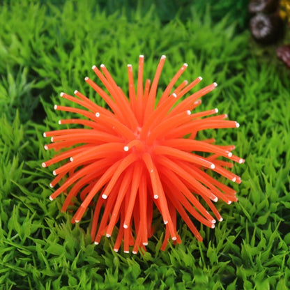 Orange spiky sea urchin ball coral decoration with pointy arms, aquarium ornament.