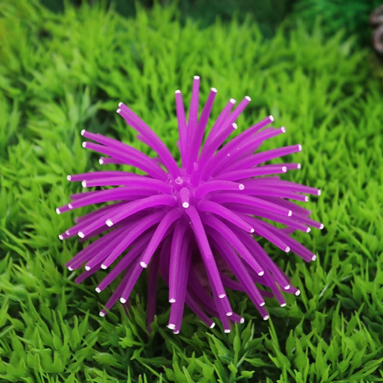 Purple spiky sea urchin ball coral decoration with pointy arms, aquarium ornament.
