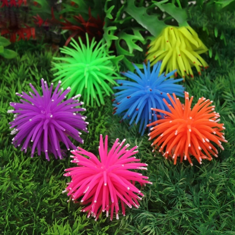 Group of spiky sea urchin ball coral decorations in green, blue, purple, pink, and orange.