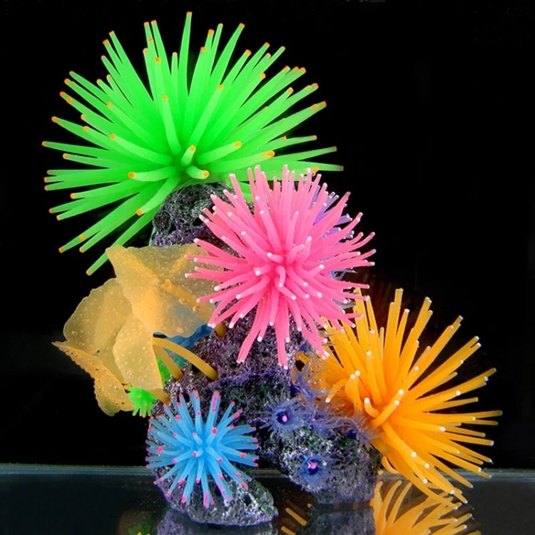 Cluster of colorful spiky sea urchin ball coral decorations on aquarium rocks.