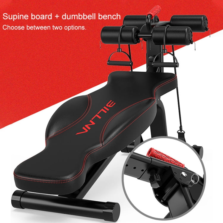 Black supine board exercise bench with red rollers and two dumbbell-style weight bars