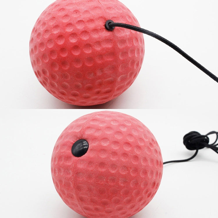 Red textured training boxing balls with black eyelets and connected pull cord