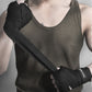 Black boxing hand bandage wrapped across the wrist and forearm, with a fist.