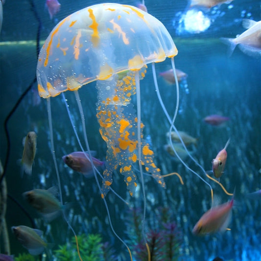 Translucent silicone jellyfish aquarium decoration with orange glowing spots and tentacles