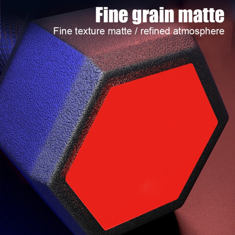 Close-up hex dumbbell end cap with red hex insert and textured matte finish.