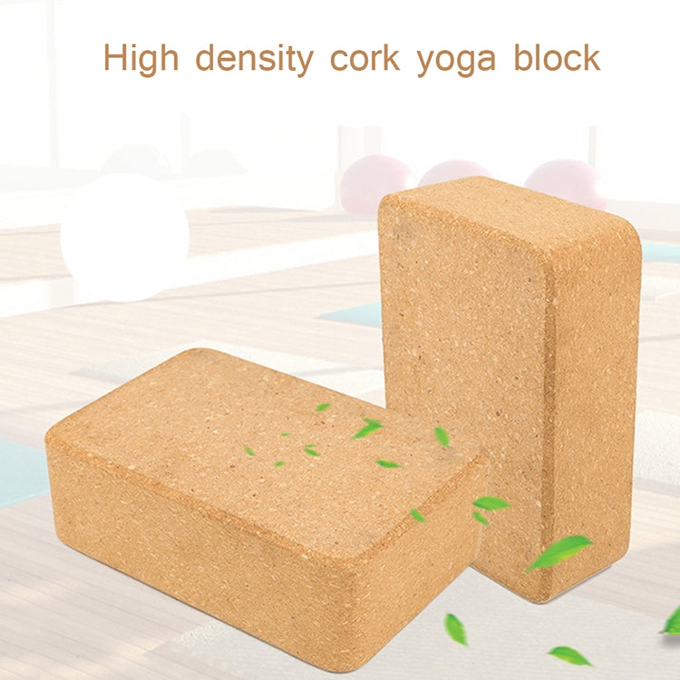 Two tan cork yoga blocks stacked, rectangular bricks with coarse cork texture