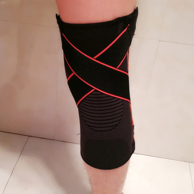 Black XL knee brace on leg with red diagonal compression lines and textured knit