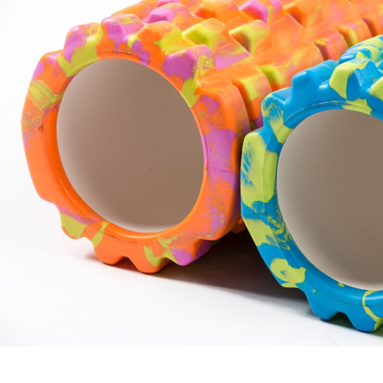 Close-up of two multicolor high-density foam rollers with dimpled texture