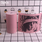 Pink thermal label paper roll and portrait-style printed sticker sheet