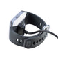Smart watch charging clip dock with black cable and visible contact points
