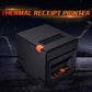 Black thermal receipt printer with orange latch and top paper slot, rugged desktop design.