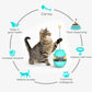 Turquoise cat treat tumbler with dangling cord and clear base, shown as an interactive toy