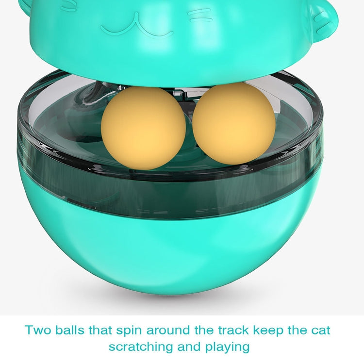 Close-up of turquoise cat treat tumbler with two yellow treat balls in the clear base