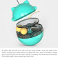 Turquoise cat treat tumbler with lid open, showing two yellow balls inside the base