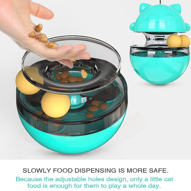 Turquoise cat treat tumbler with open lid, hand adding treats, and yellow balls inside