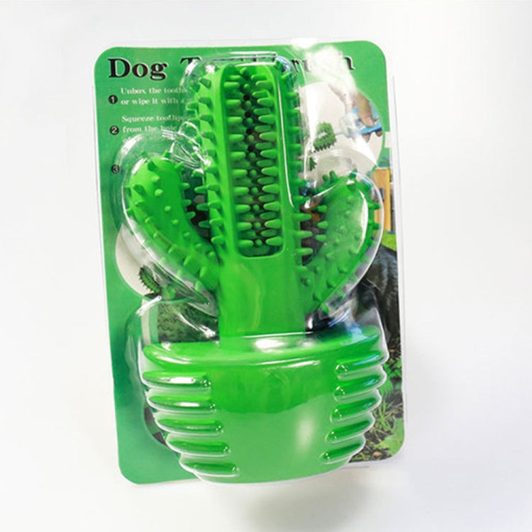 Green dog dental toothbrushing toy in blister pack with cactus spike brush