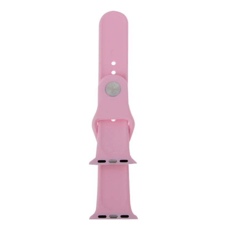 Pink rubber watch band with pin-and-tuck closure, underside view with pin plate