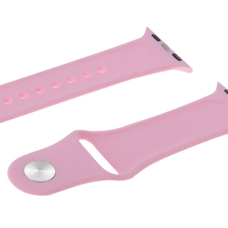 Pink rubber watch band with pin-and-tuck closure, buckle end with metal pin