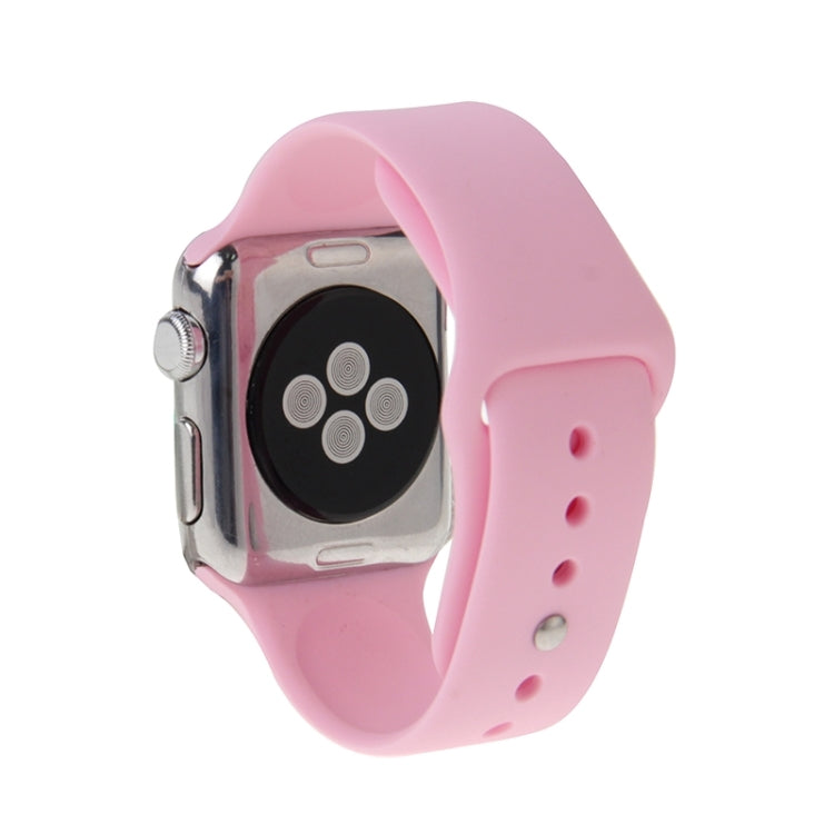 Pink rubber Apple Watch band with pin-and-tuck closure, watch case and strap shown
