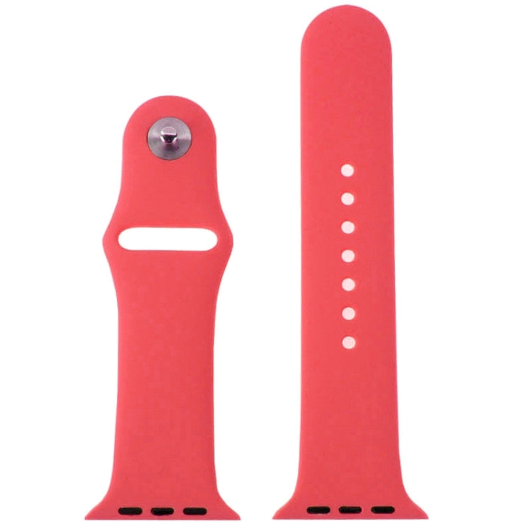 Red rubber watch band with metal pin-and-tuck keeper and evenly spaced hole rows