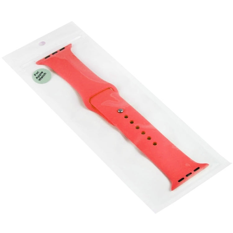 Red rubber watch band in packaging with pin-and-tuck closure