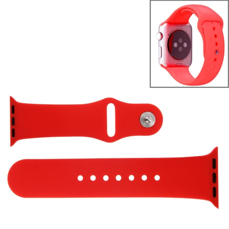 Red rubber Apple Watch sport band with pin-and-tuck closure and adjustment holes