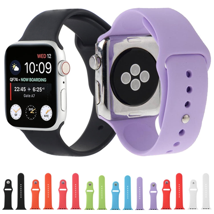 Assorted rubber Apple Watch sport bands in multiple colors, with pin-and-tuck closures