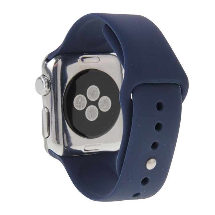 Navy rubber sport watch band with pin-and-tuck closure shown on Apple Watch