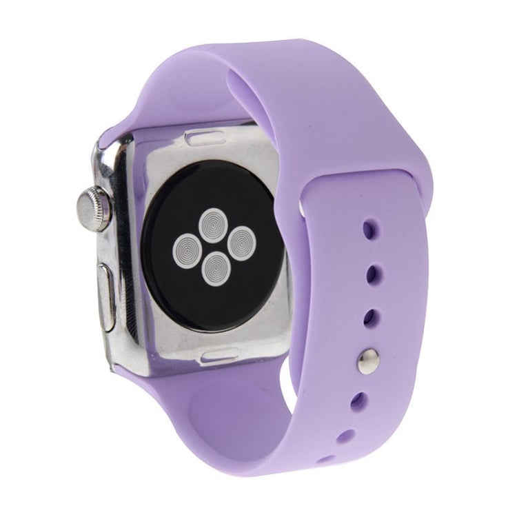 Purple rubber sport watch band with pin-and-tuck closure shown on Apple Watch