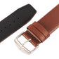 Brown leather watch band detail with square silver buckle and perforation holes