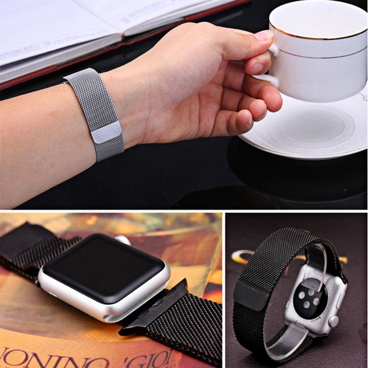 Magnetic Milanese loop watch band on wrist with silver watch case and strap detail