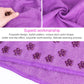 Purple microfiber yoga blanket fabric with visible stitching along the edge