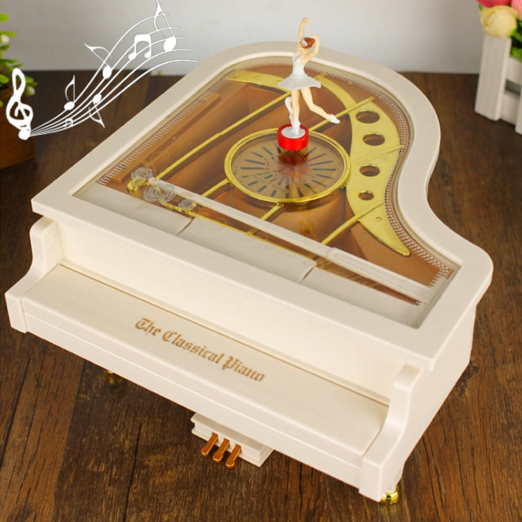 White mechanical music box piano with ballerina dancer figurine