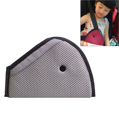 Grey car seat belt adjuster pad with black trim and mesh texture, rounded dome