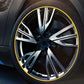 Yellow wheel rim trim ring around alloy wheel