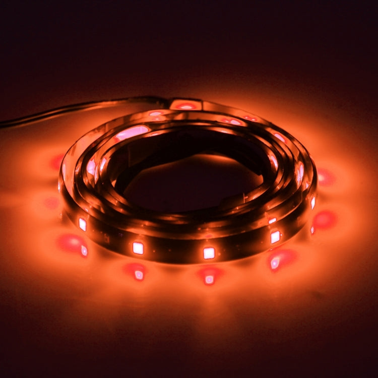 Flexible LED car strip lights with orange glow, coiled 120cm strips with leads