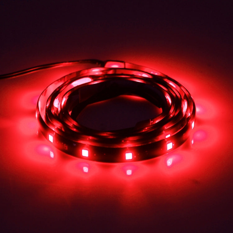 Flexible LED car strip lights with red glow, coiled 120cm strips with visible leads
