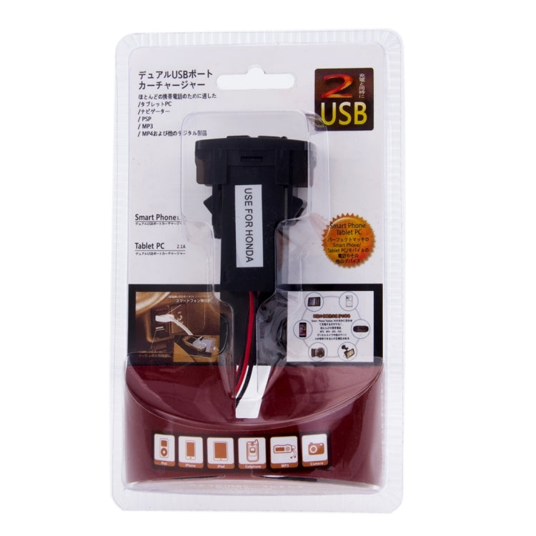 Dual USB car charger adapter in retail blister pack labeled HONDA