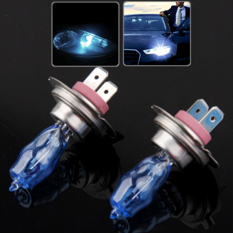 Halogen car headlight bulbs pair with blue glass, metal ring base, pink insulator clips.