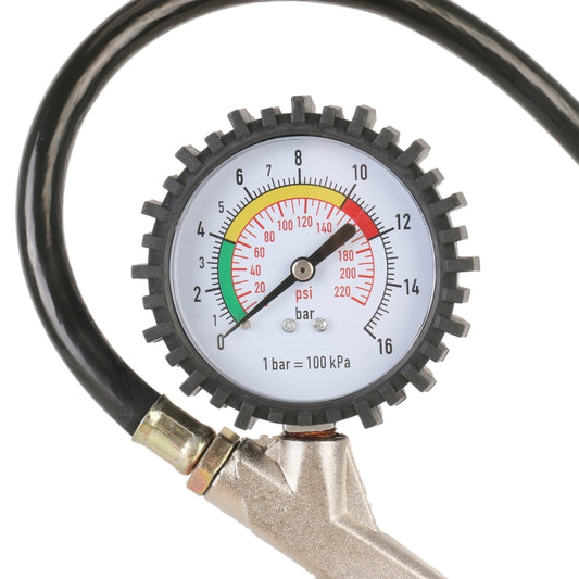 Round analog tire pressure gauge with red/green dial markings and black knurled housing
