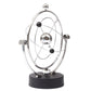 Kinetic orbital desk toy in chrome with layered orbit loops and black base