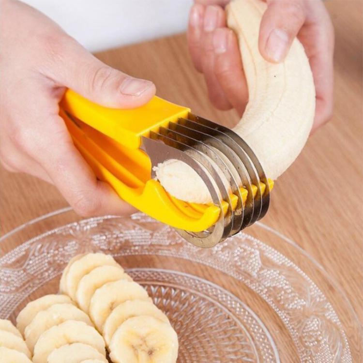 Yellow banana slicer creating uniform banana slices with stainless steel ring blades