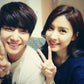 Two people smiling while posing together