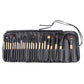 Open black brush roll showing multiple bristle brushes with wooden handles and bag strap