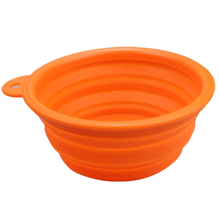 Orange collapsible silicone pet feeder bowl with handle, empty