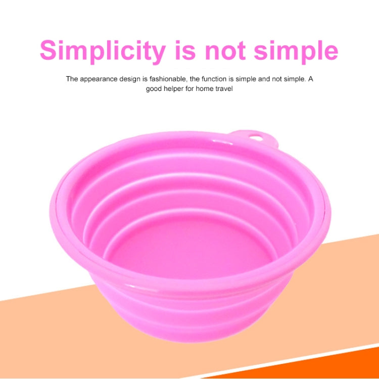 Pink collapsible silicone pet feeder bowl with side handle, empty