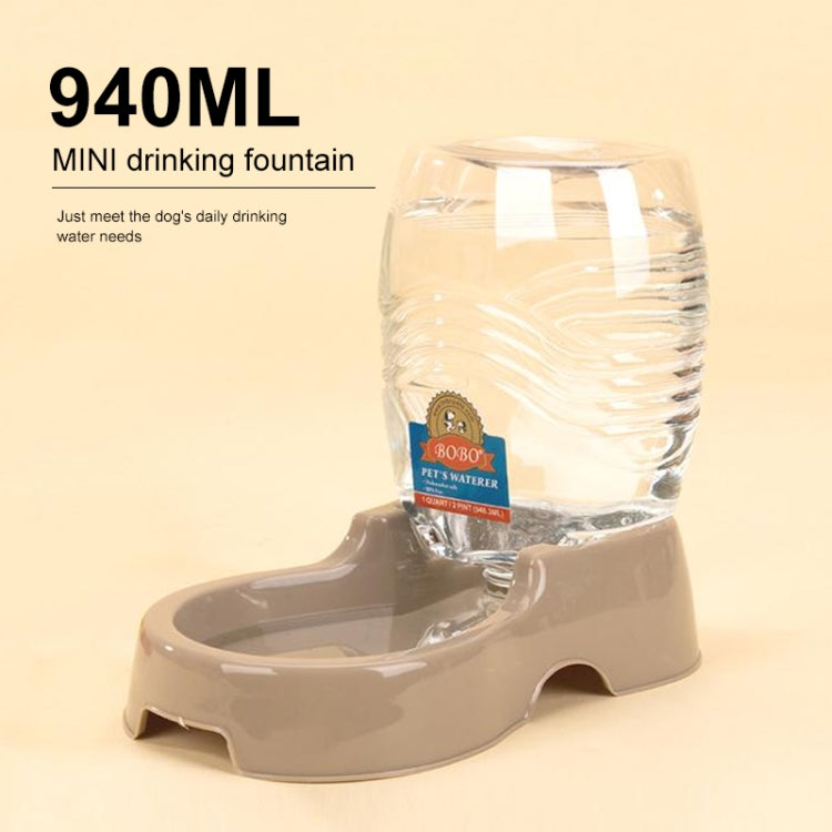 Mini automatic pet water fountain with clear bottle and beige base