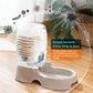 Clear water bottle on beige automatic pet dispenser base with side bowl
