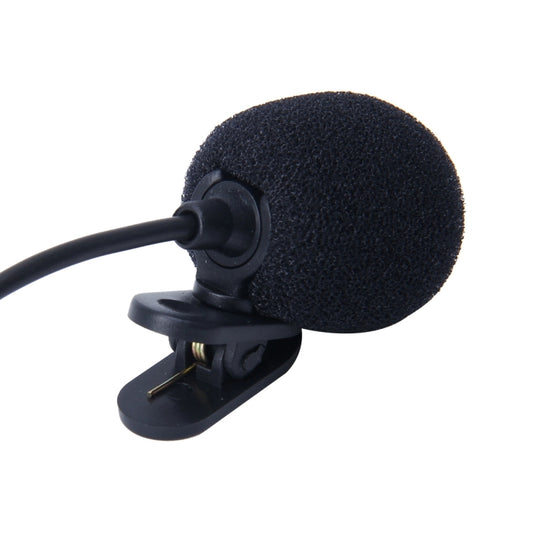 Close-up of wired clip microphone with round foam windscreen